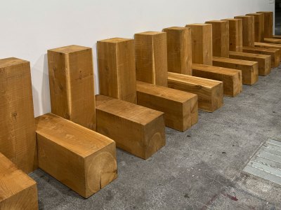 Alternate the vertical and horizontal beams of the wood on the white wall.