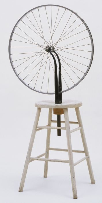 The bicycle wheels are mounted on the stool.