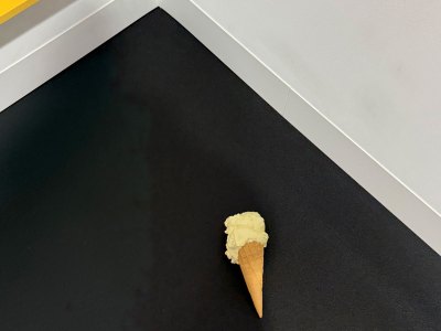 Bronze sculpture with ice cone with a tablespoon of vanilla.