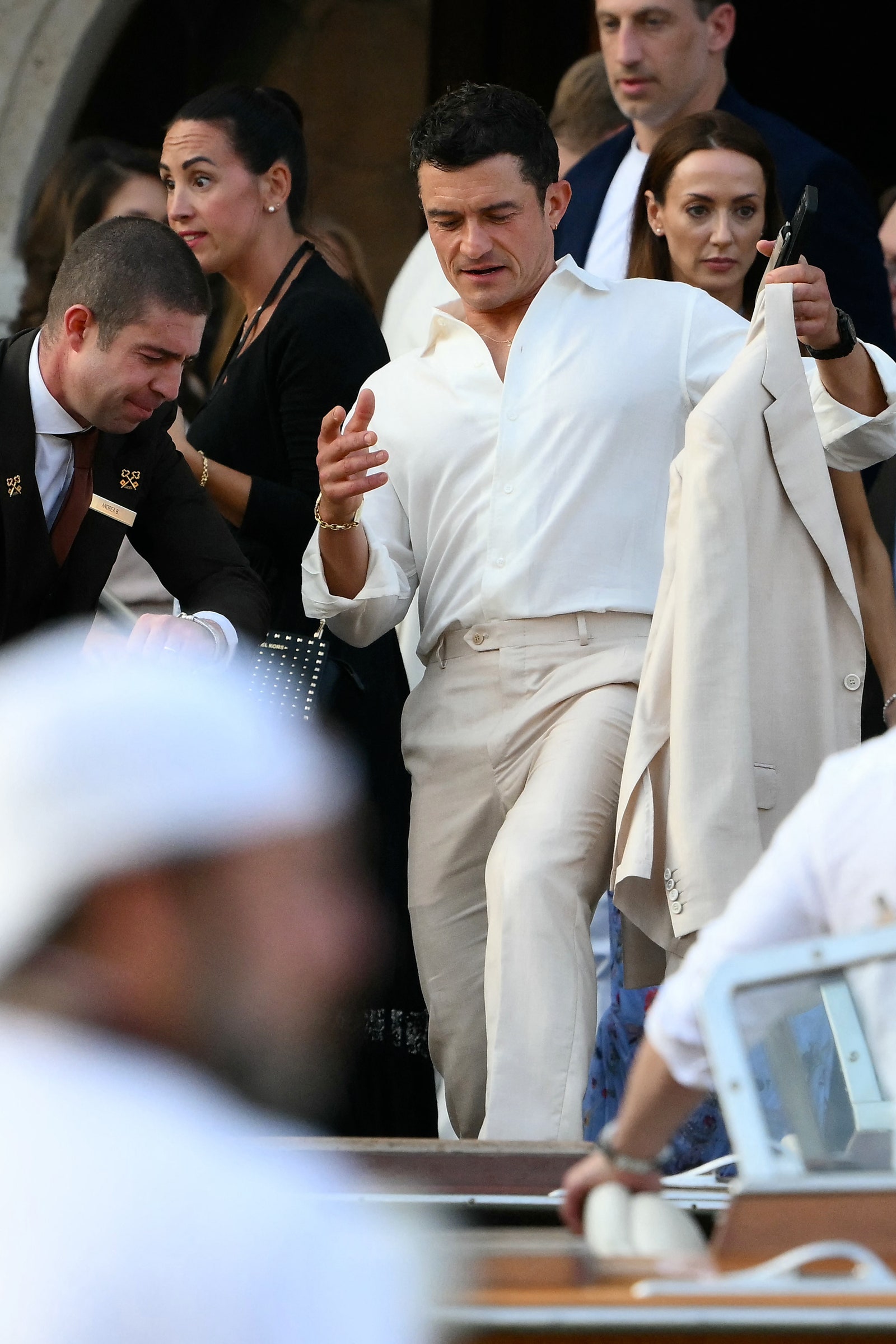 Images may contain Orlando Bloom adult accessories formally wearing watch hat head and face