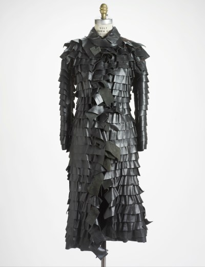 A coat made of pleated leather strips.