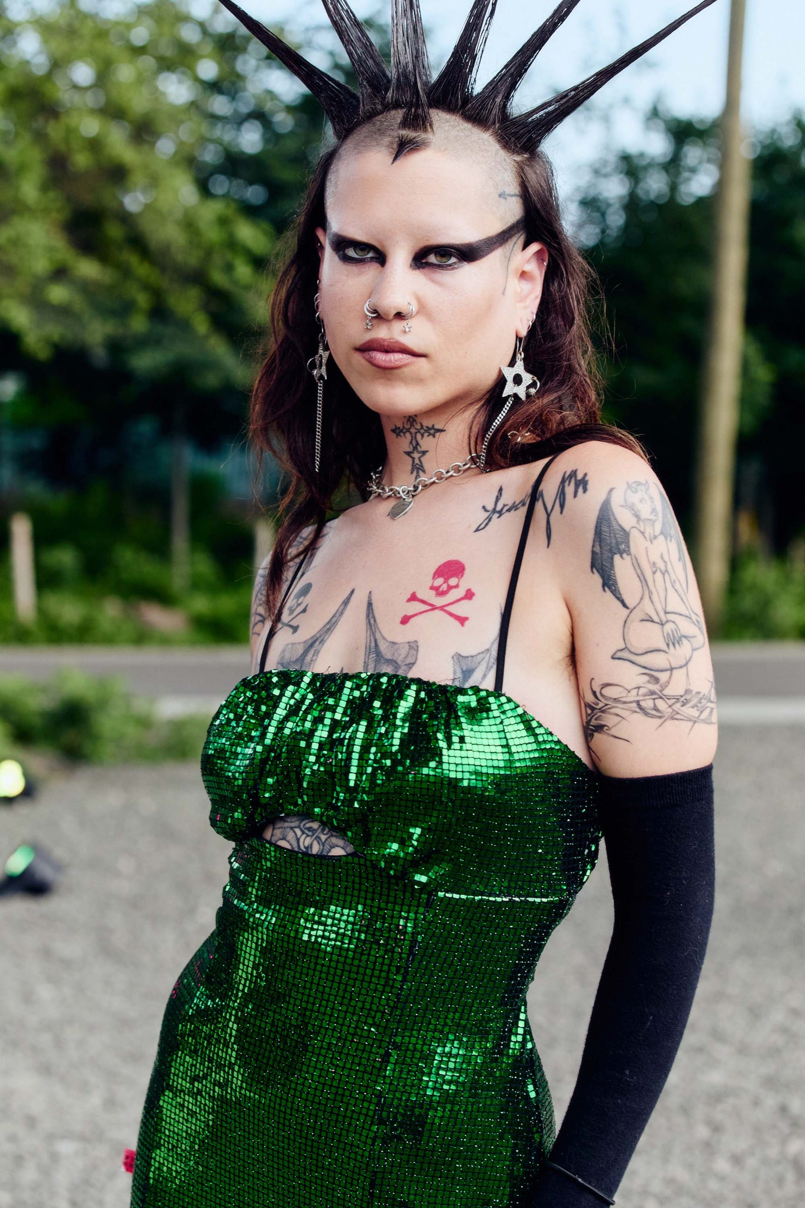 Images may contain adult skin tone tattoo accessories jewelry necklace and hair