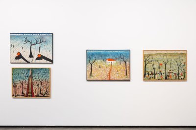 Four paintings of mostly pastoral scenes by José Antônio da Silva hang on a wall. 