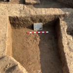 Excavation trench shows mud brick layers and foundation walls in Tell Al-Faraun.