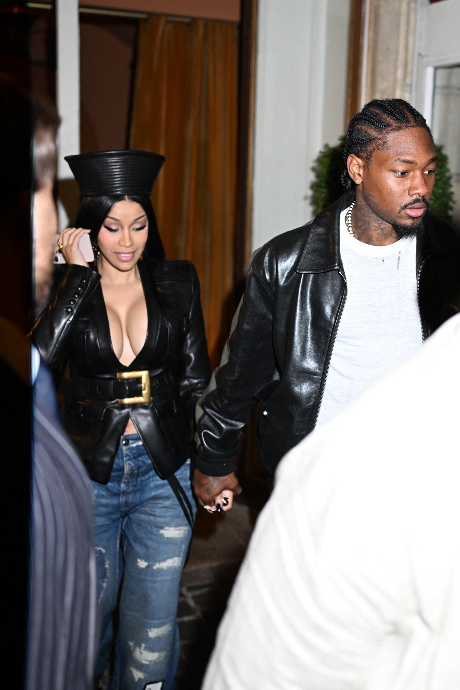 Images may contain Stefon Diggs Cardi B Clothing Jacket Adult Pants Wedding Staff Accessories and Bags
