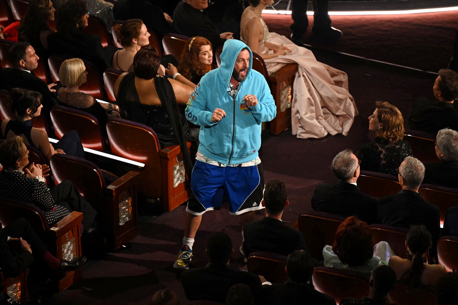 Images may contain Adam Sandler Madge Gill Slash People Clothing Shoes Shoes Adults and Kids