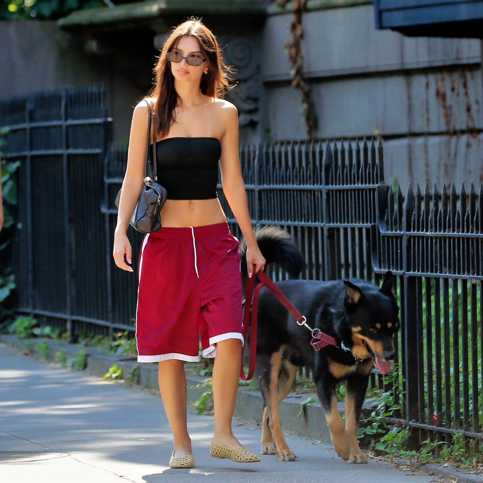 Exclusive Emily Ratajkowski in coma Nike shorts and flats on black tube while walking her German...