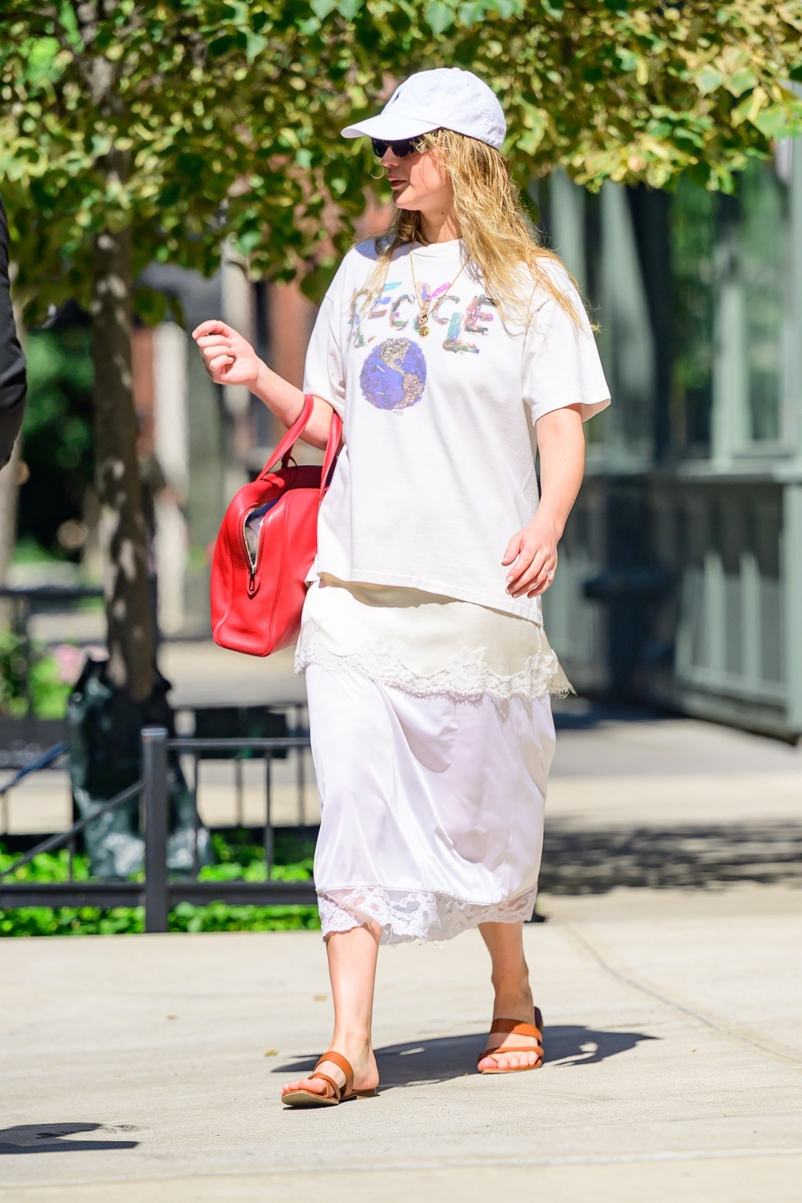 Images may contain accessories bags tote bags adult clothing shorts hat glasses shoes sandals and jewelry