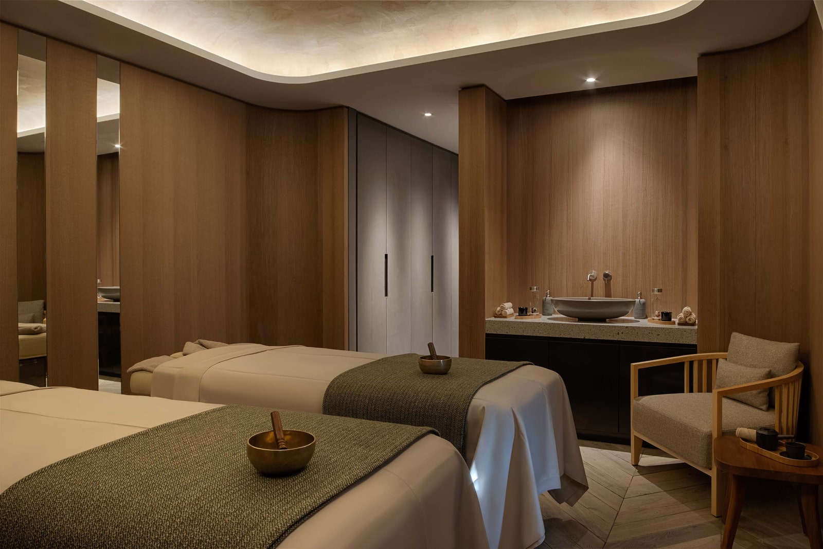 Images may contain chair furniture sink bed spa faucet faucet and cup