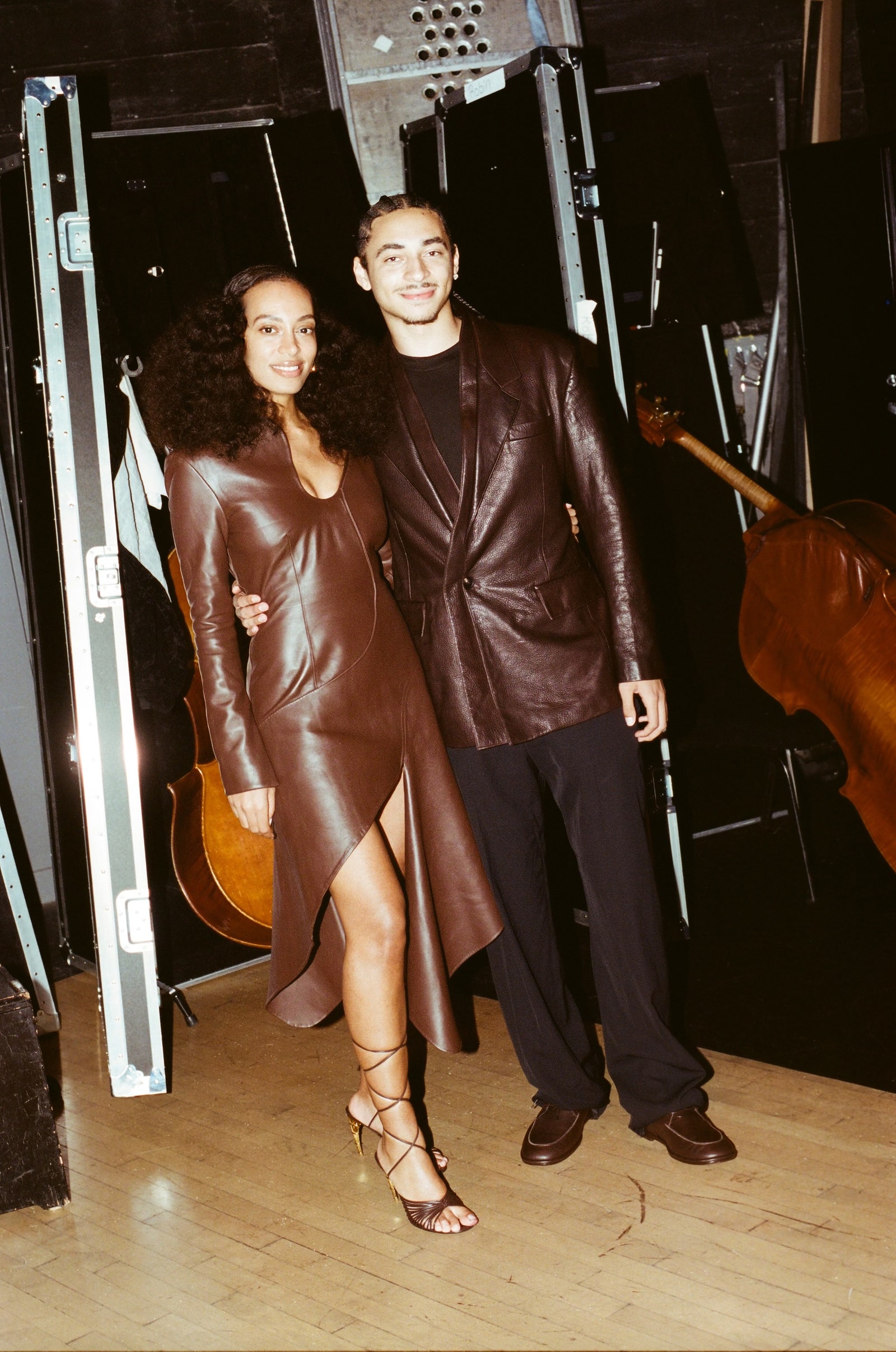 Images may contain Solange clothing jacket adult shoes high heel guitar and musical instruments