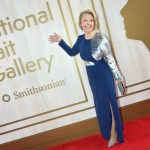 Woman in a dress next to the country portrait gallery logo.