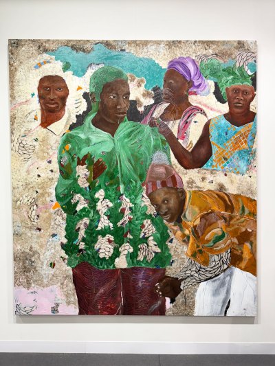 A painting shows the clothes of five black figures.