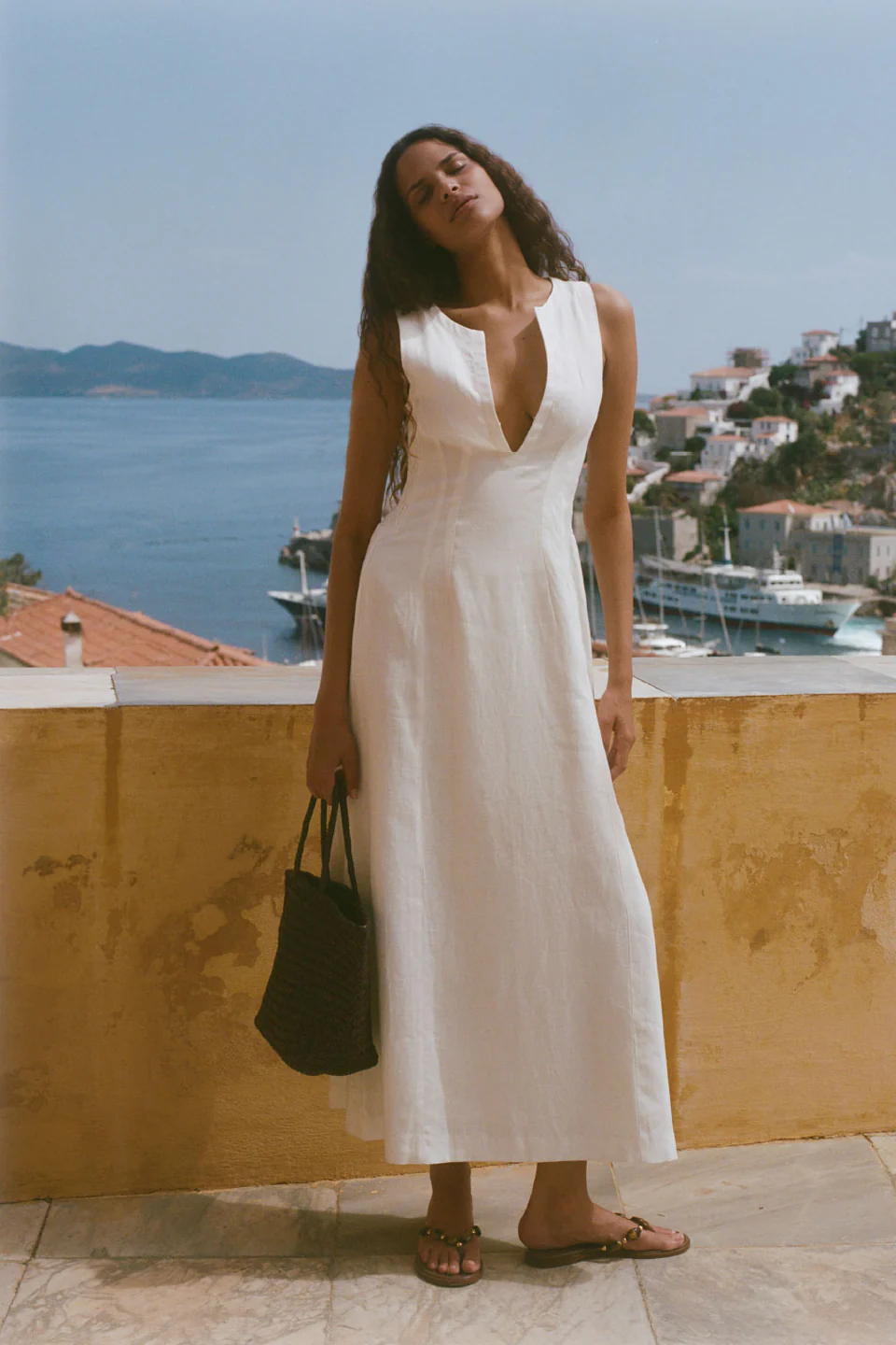 Images may contain clothing, dresses, beach outfits, adult formal wear accessories, handbags and fashion