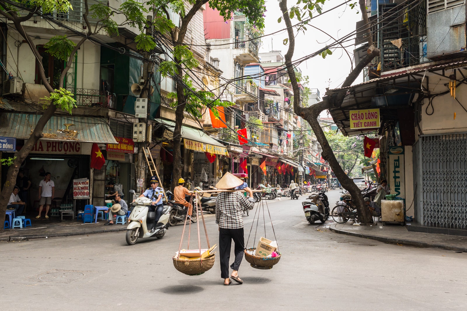 Images may contain city street people clothing hat shoes motorcycle transportation and vehicles