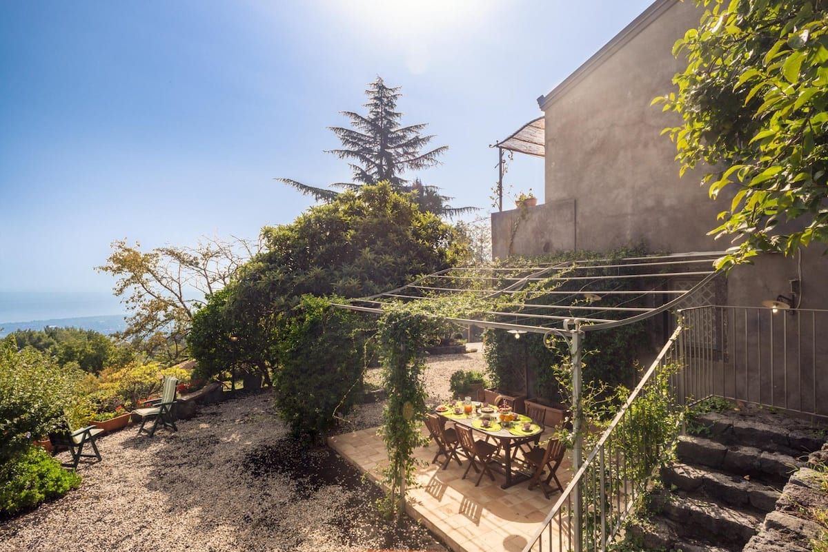 Images may contain natural outdoor scenery garden terrace building house housing villa and backyard
