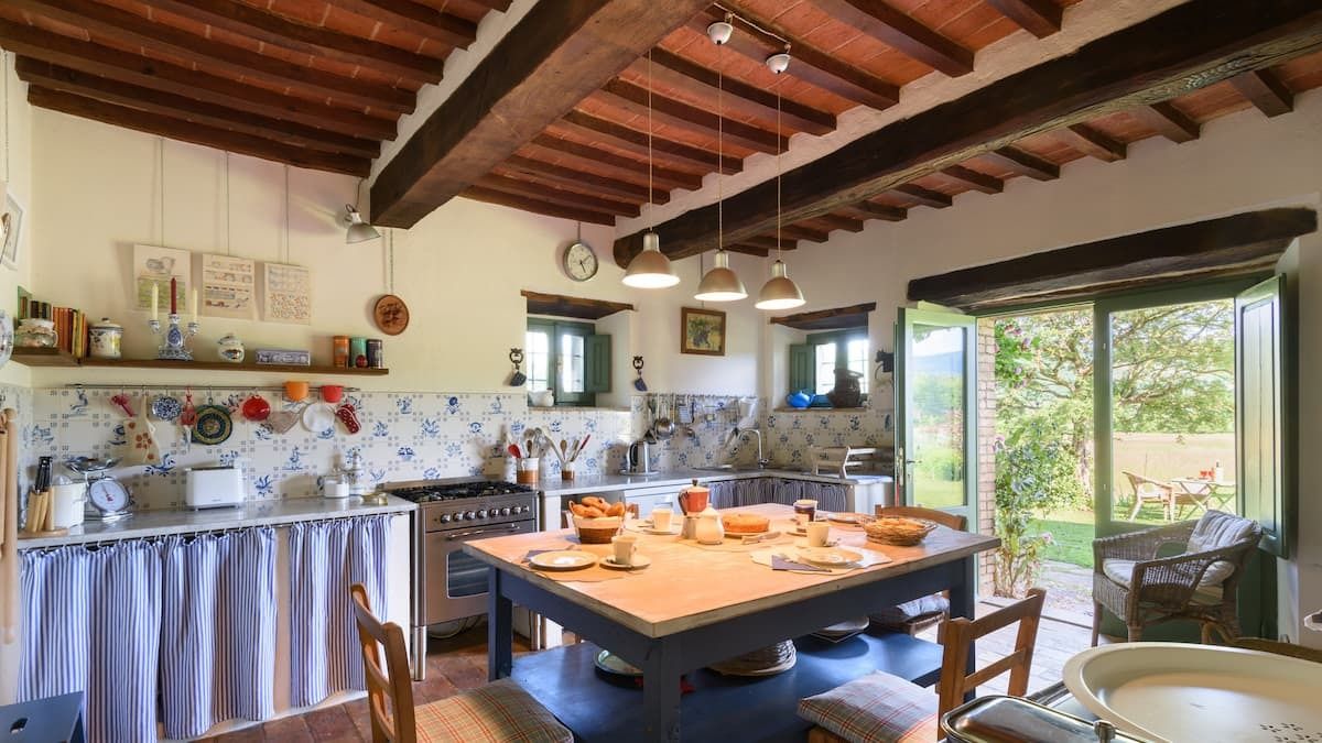 Images may contain architectural dining table furniture indoor dining table chair cups and wood