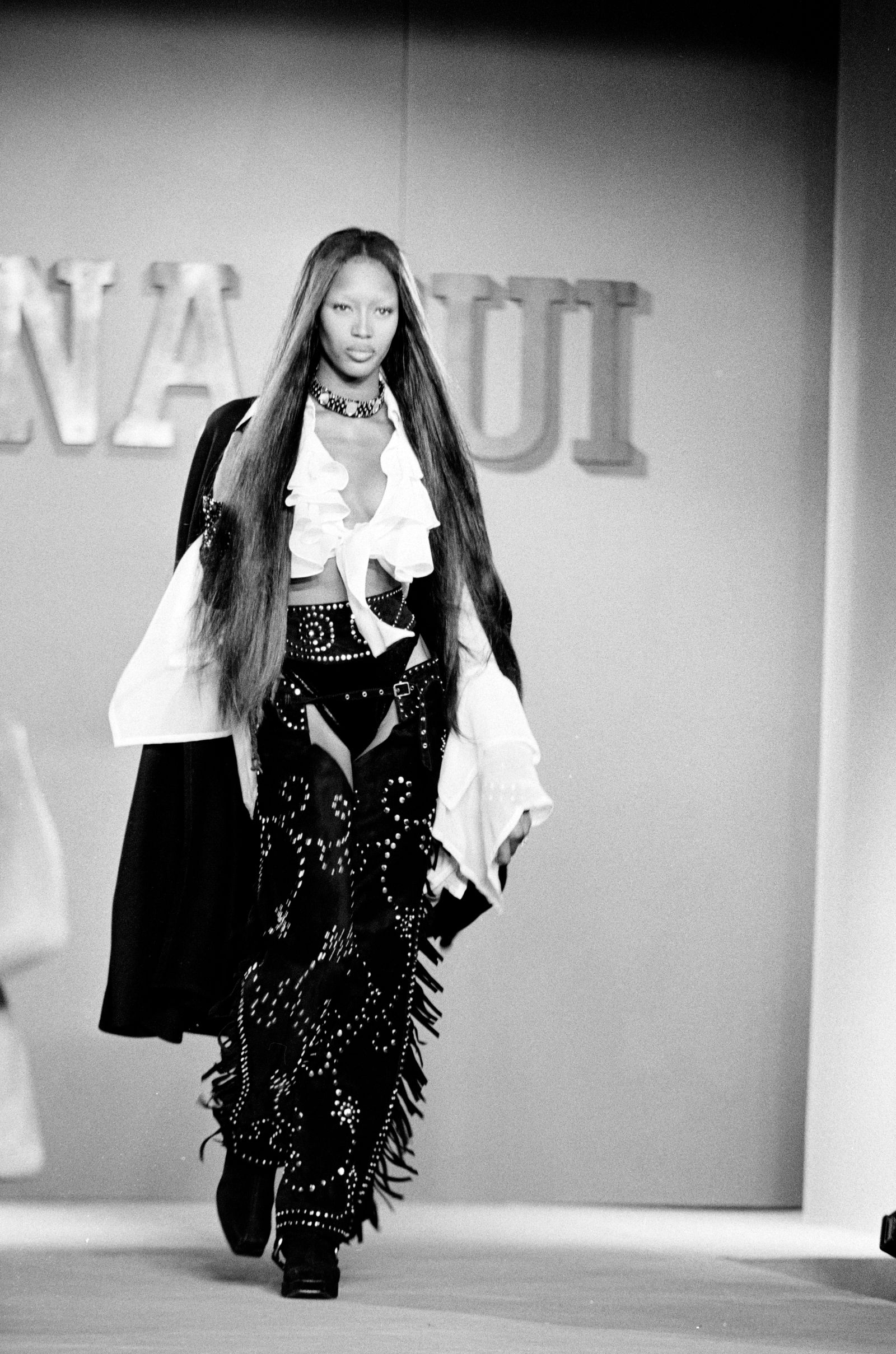 Images may contain Naomi Campbell fashionable adult clothing long sleeves face and formal wear