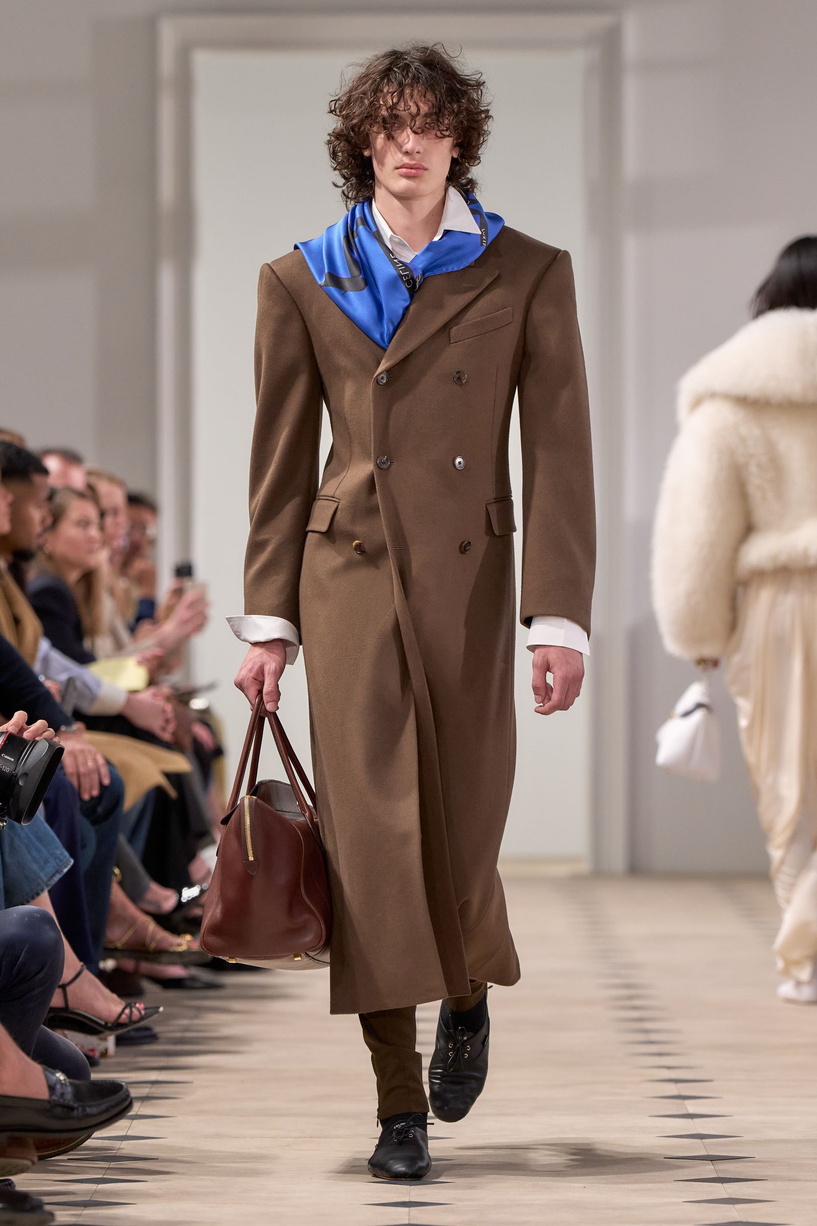 Images may contain Pierdavide Carone Clothing Coat Accessories Bags Totes Bags Adults and Shoes