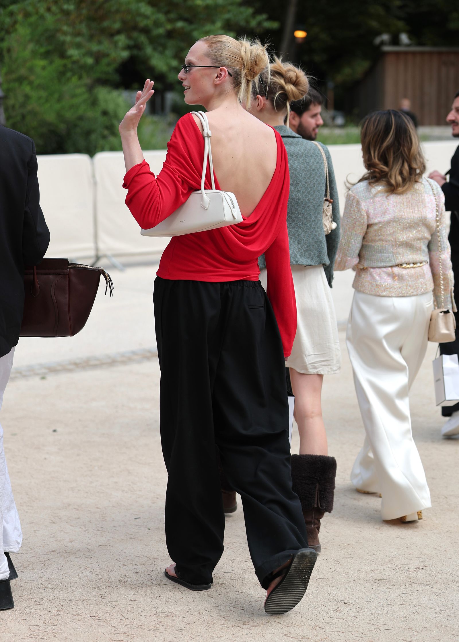Images may contain human trail accessories handbags handbags clothing shoes glasses pants high heels and adults