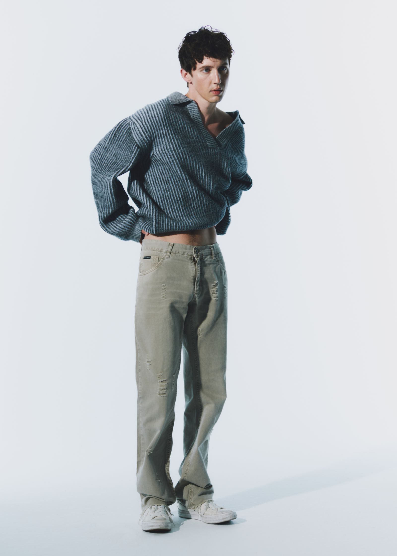 Images may contain clothing, knitted sweaters, pants, adult footwear and shoes