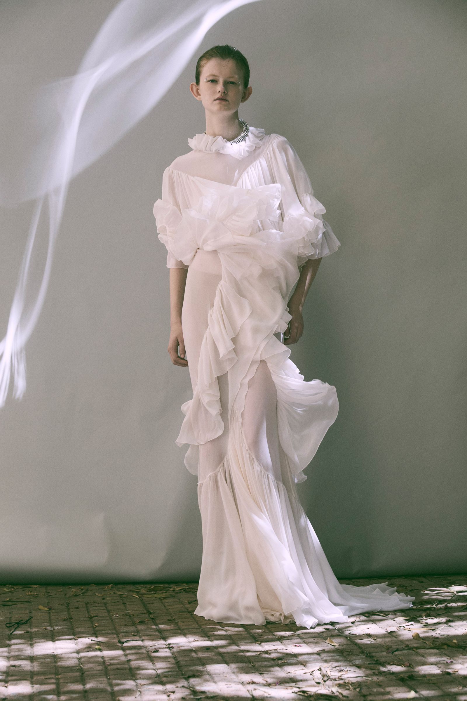 Images may contain wearing fashion formal dress dress wedding dress adult and standing