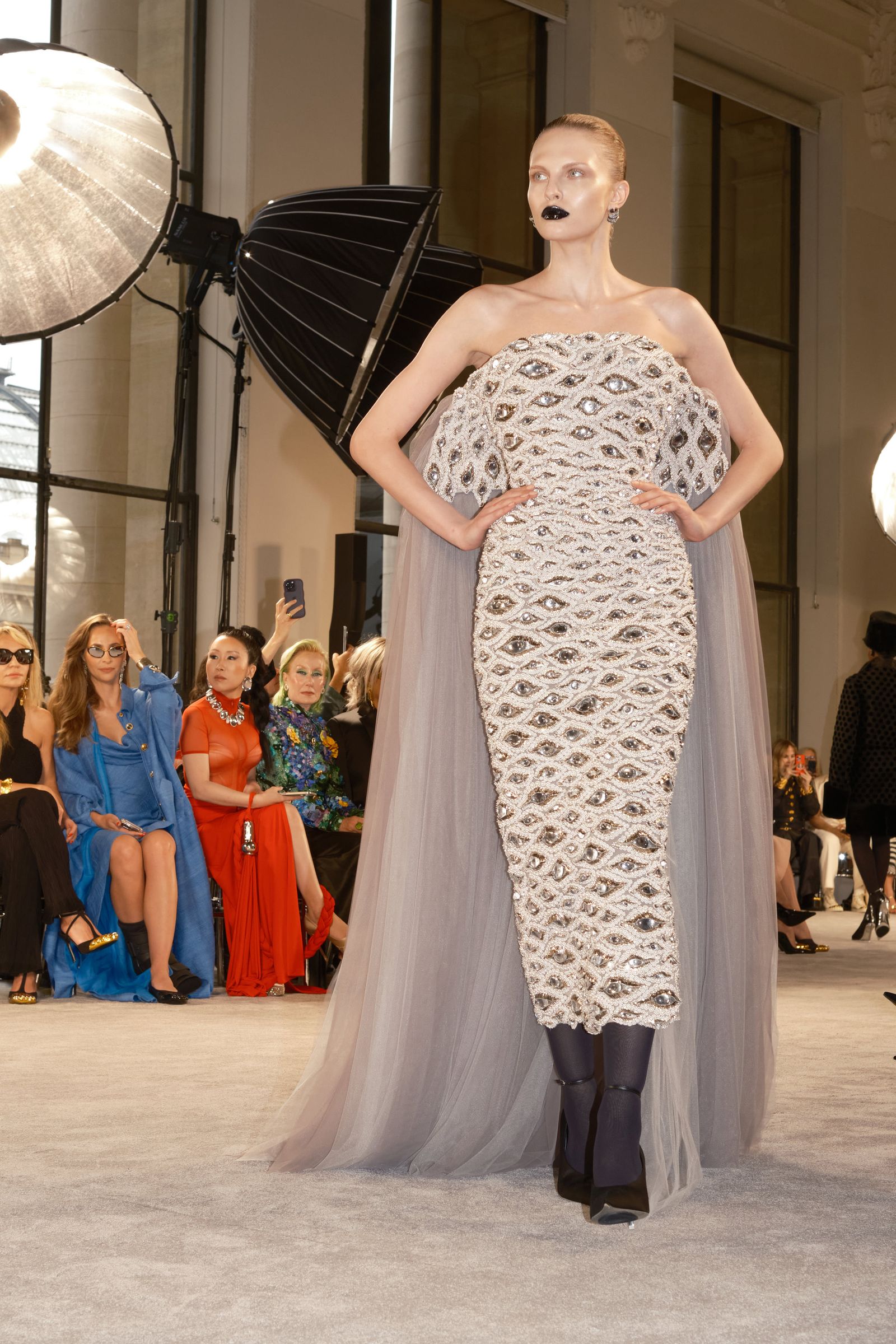 Images may contain Ivana Wong Caroline Cellier Clothing Dress Evening Dress formally wearing electronics and cell phones