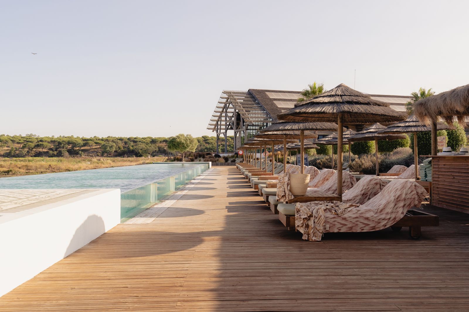 Images may contain outdoor buildingsHotel hotels swimming poolwoodwood and furniture