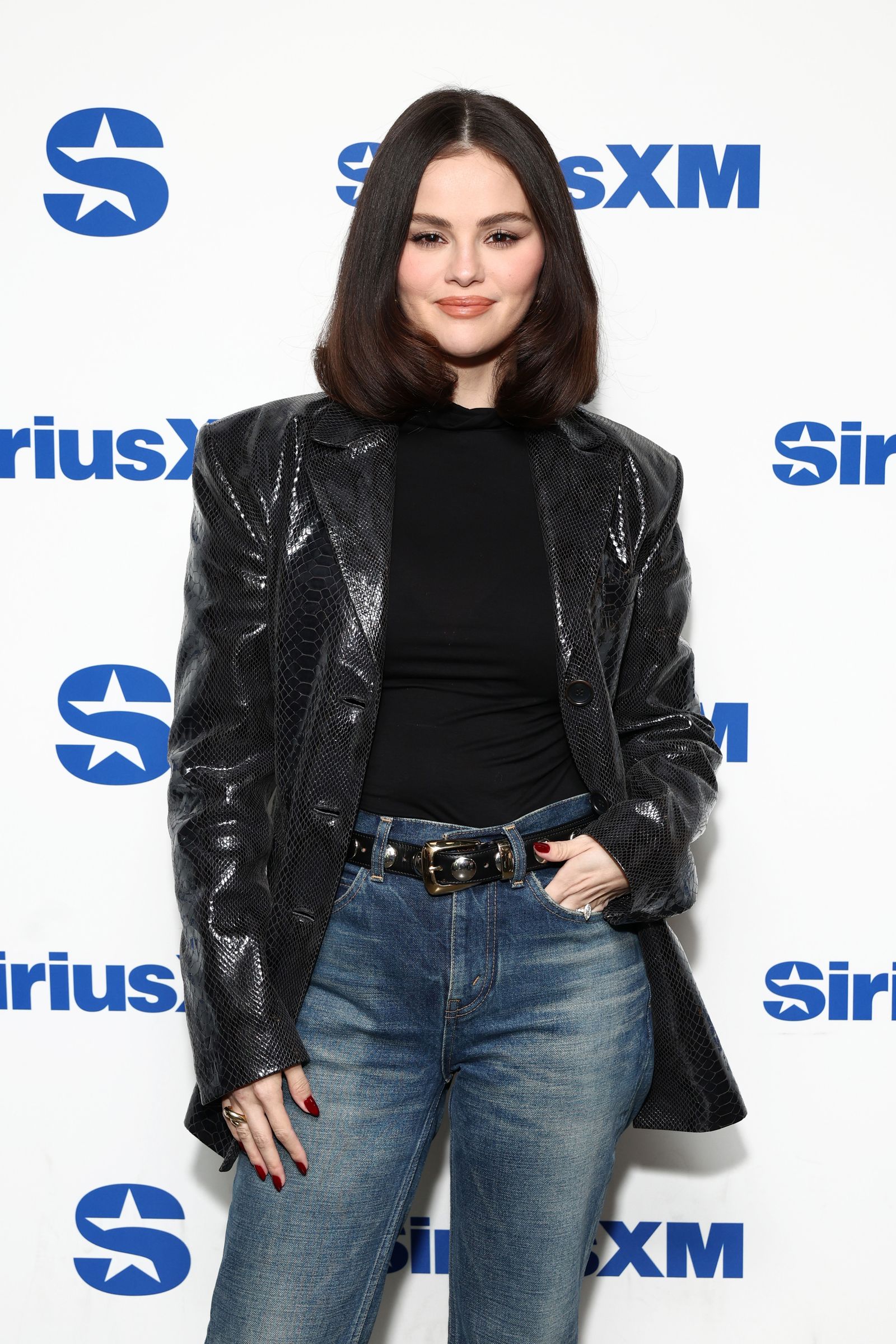 Images may contain Selena Gomez Clothing Jacket Adult Accessories Bag Handbag Jewelry Rings and Pants