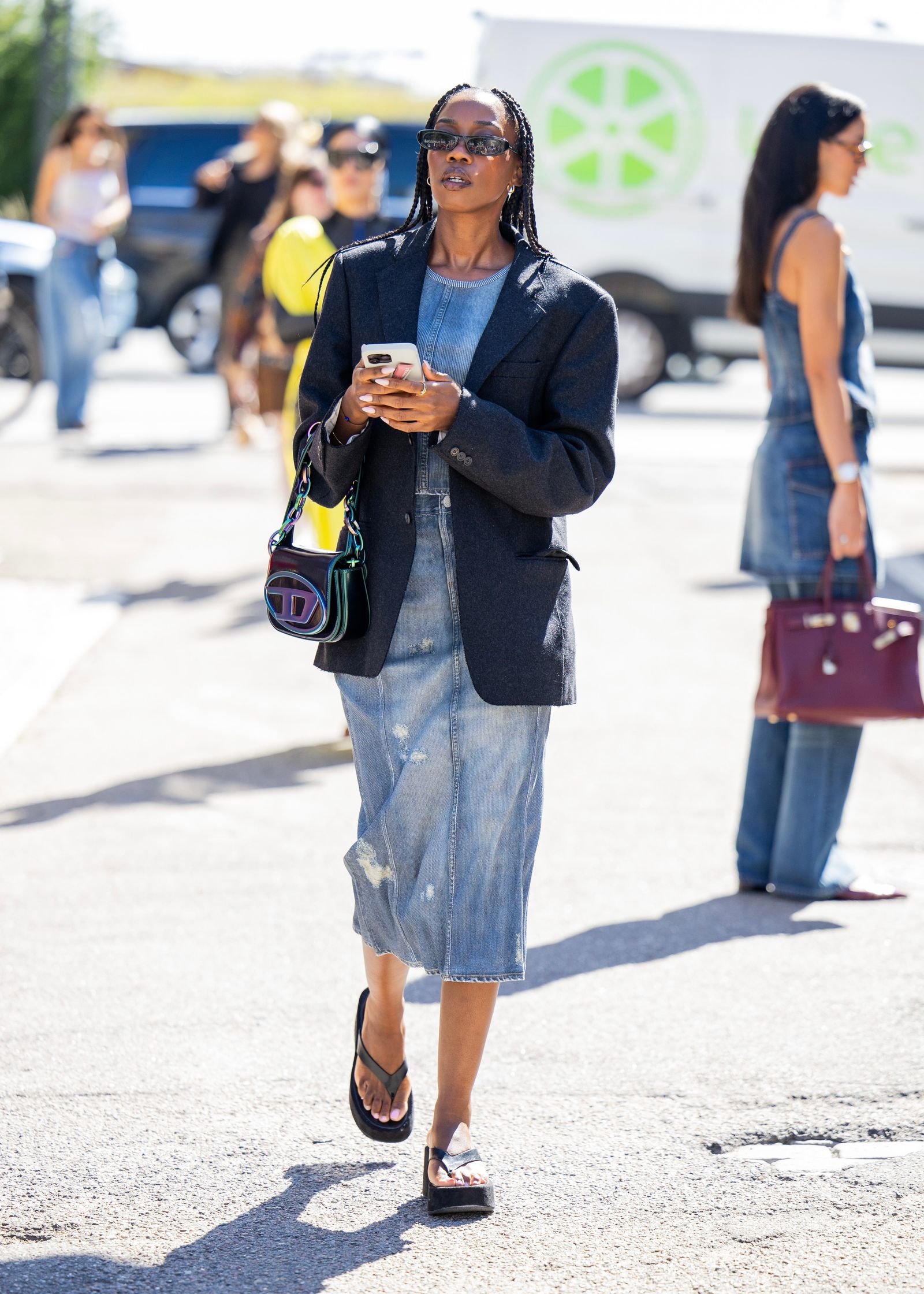 Images may contain accessories bags, handbags, pedestrian clothing, pants, glasses, shoes, adults and teenagers