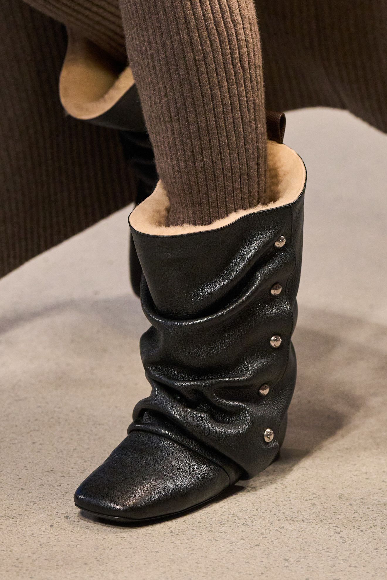Images may contain clothing shoes and boots