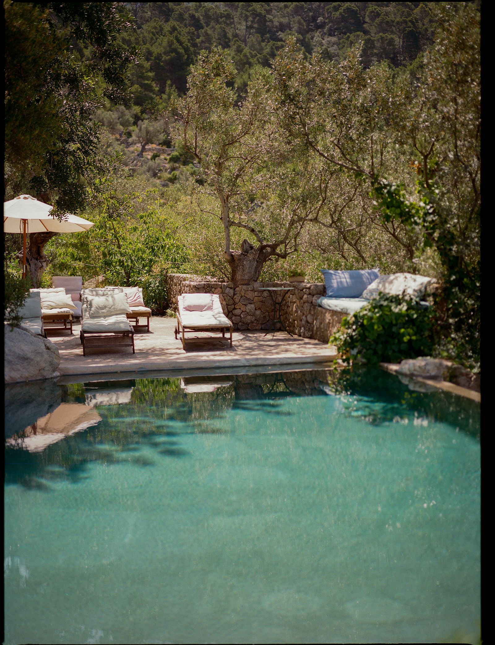 Images may contain pool water chair furniture pool building architecture hotel resort backyard and nature