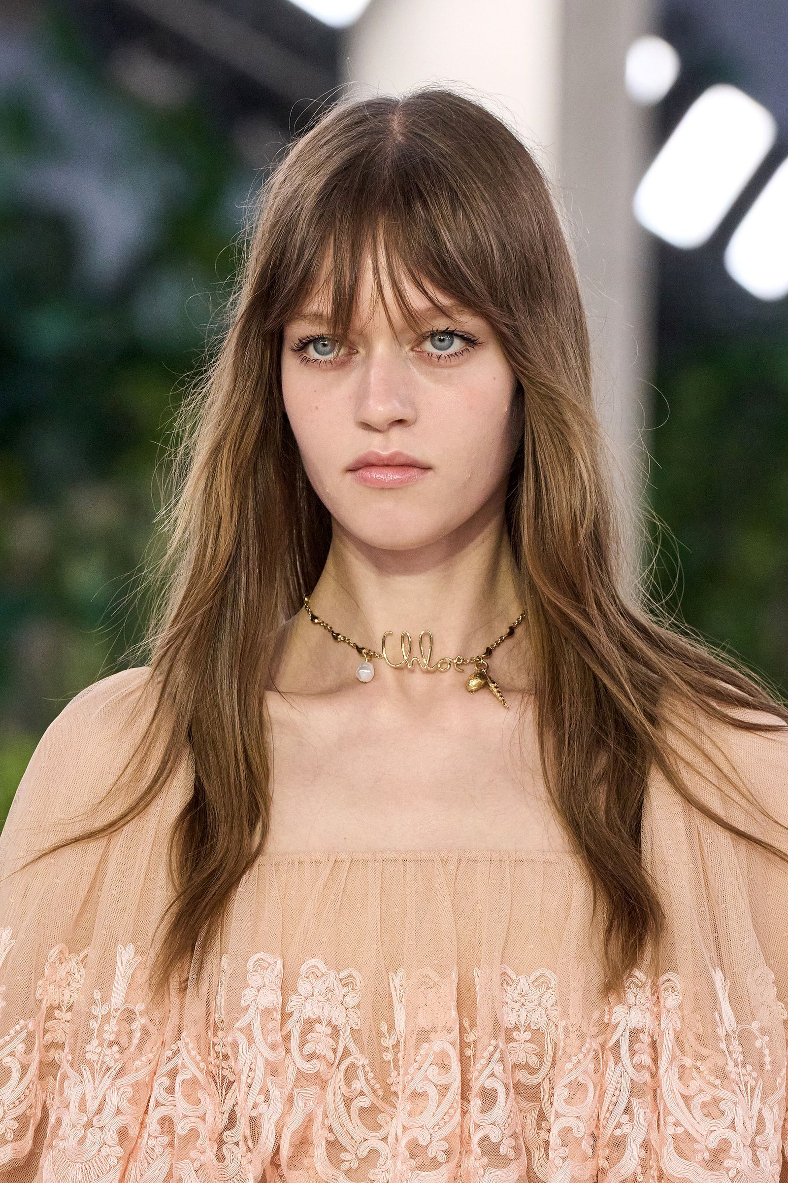Images may contain brown hair blonde jewelry jewelry and necklace