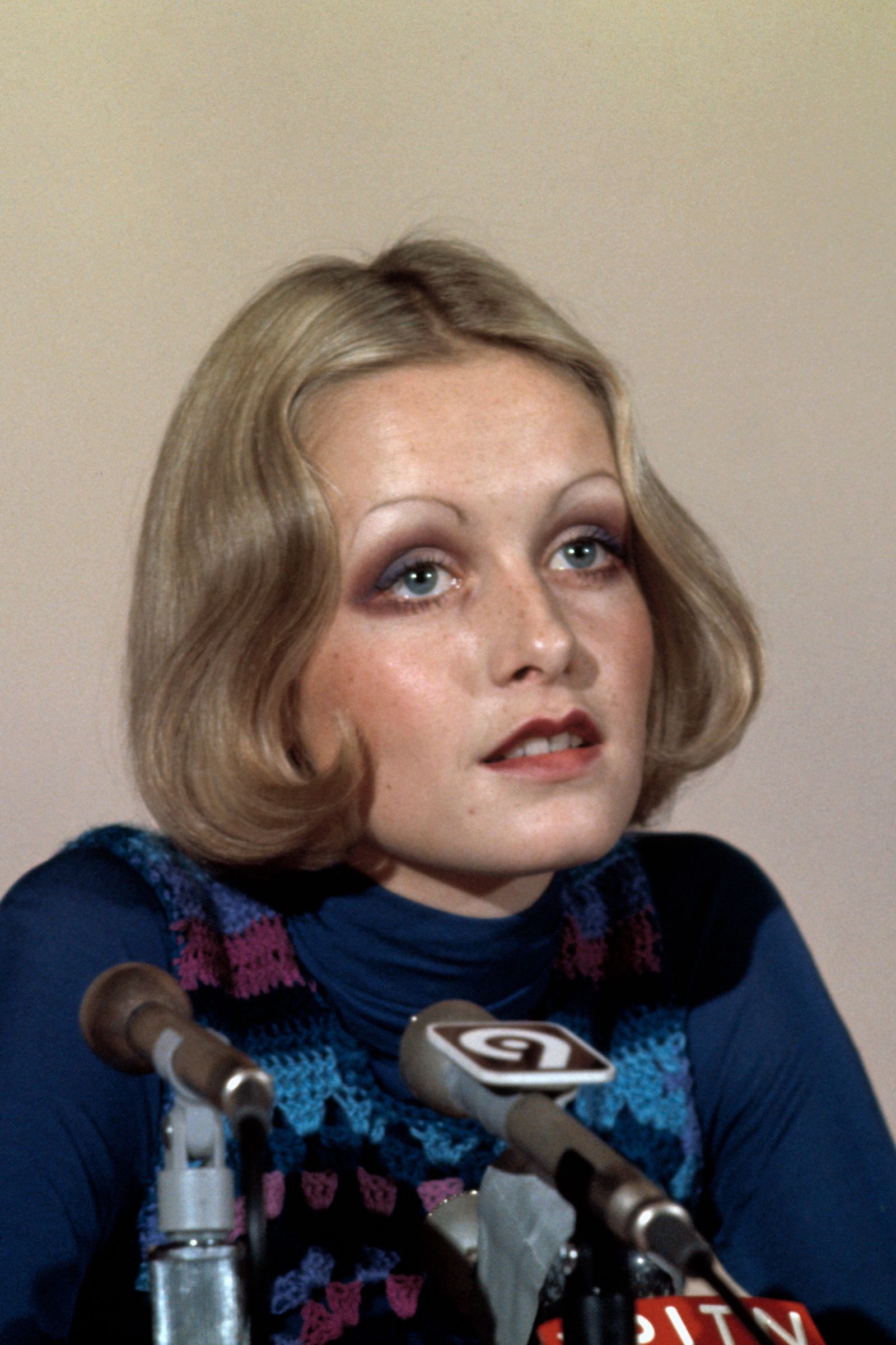 Images may contain Twiggy Lawson Face Man Photography Portrait Adult Crowd Electrical Equipment and Microphone