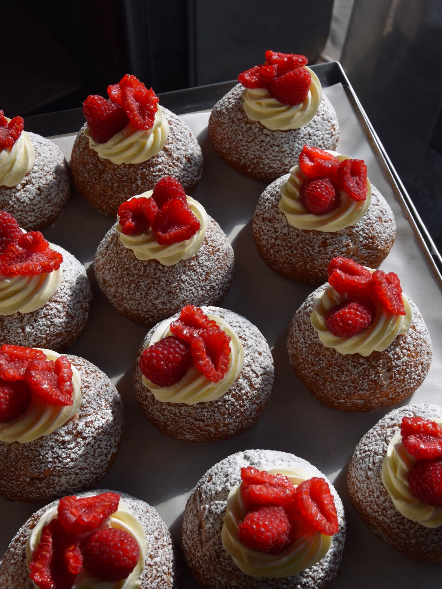 Images may contain food performance, desserts, pastries, breads, berries plants produce buttercream frosting and cakes
