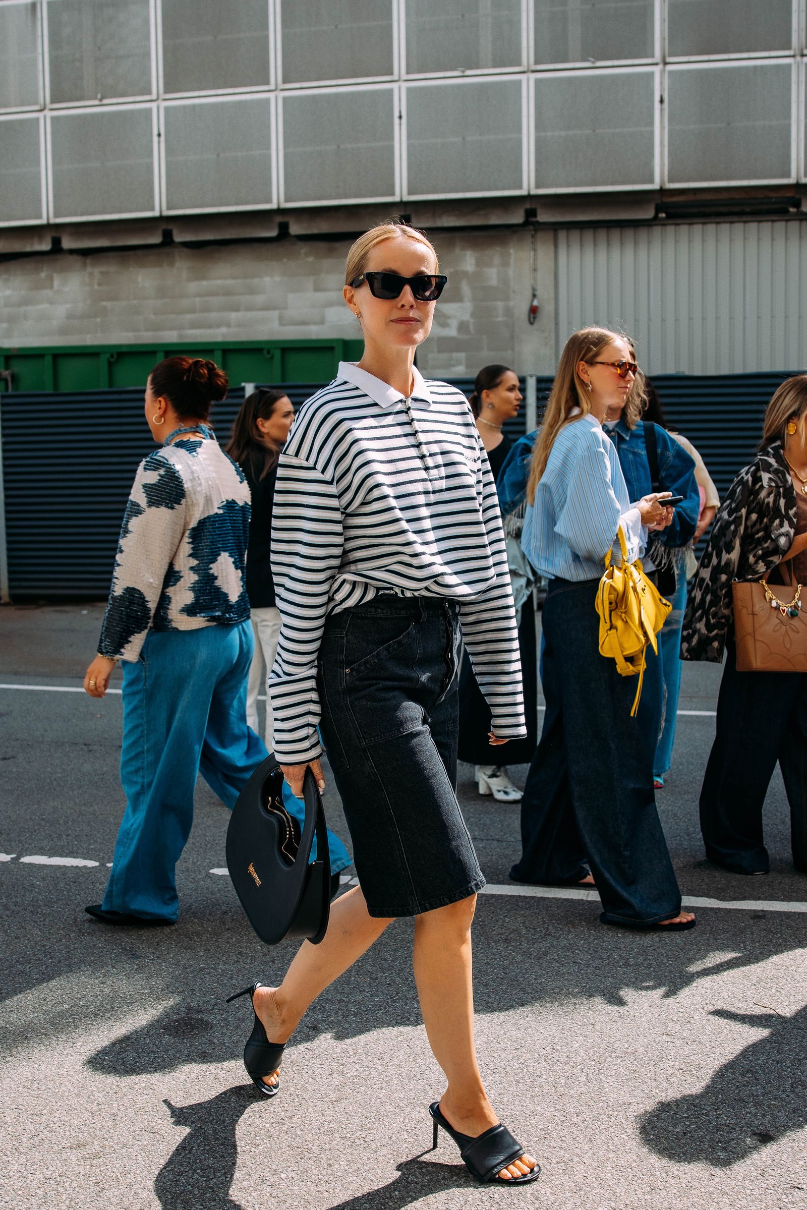 Image may contain pedestrian accessories glasses shoes walking and bags