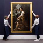 London, UK - June 27, 2025: Art handlers hold a painting called the title "David and Goliath's head" Written by Artemisia Gentileschi, believed to have been drawn in London in the 1630s, estimated: £1,000,000 to £2,000,000 - Before the Old Masters Sales in London, England on 27 June 2025, during the Optoelectronics Sales at Sotheby's Auction.