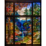 A huge stained glass window displays the nature scene in the background.