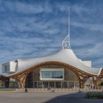 A museum with white and wavy roofs.