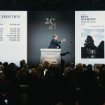 A man stood behind the podium in front of a group of people.