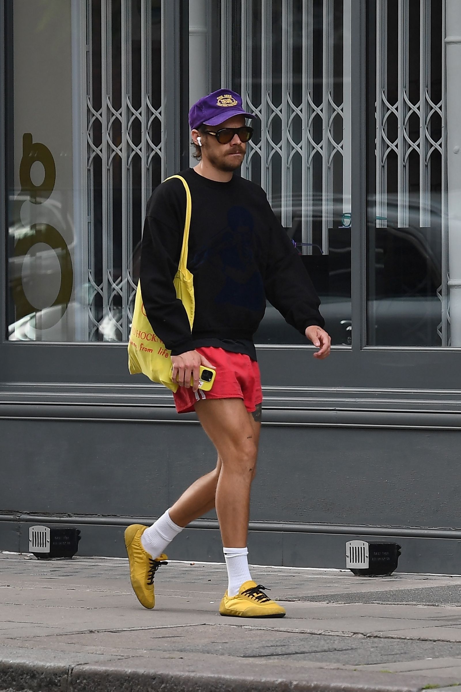 Images may contain Harry-style pedestrian clothing shoes shoes shoes shorts accessories and glasses