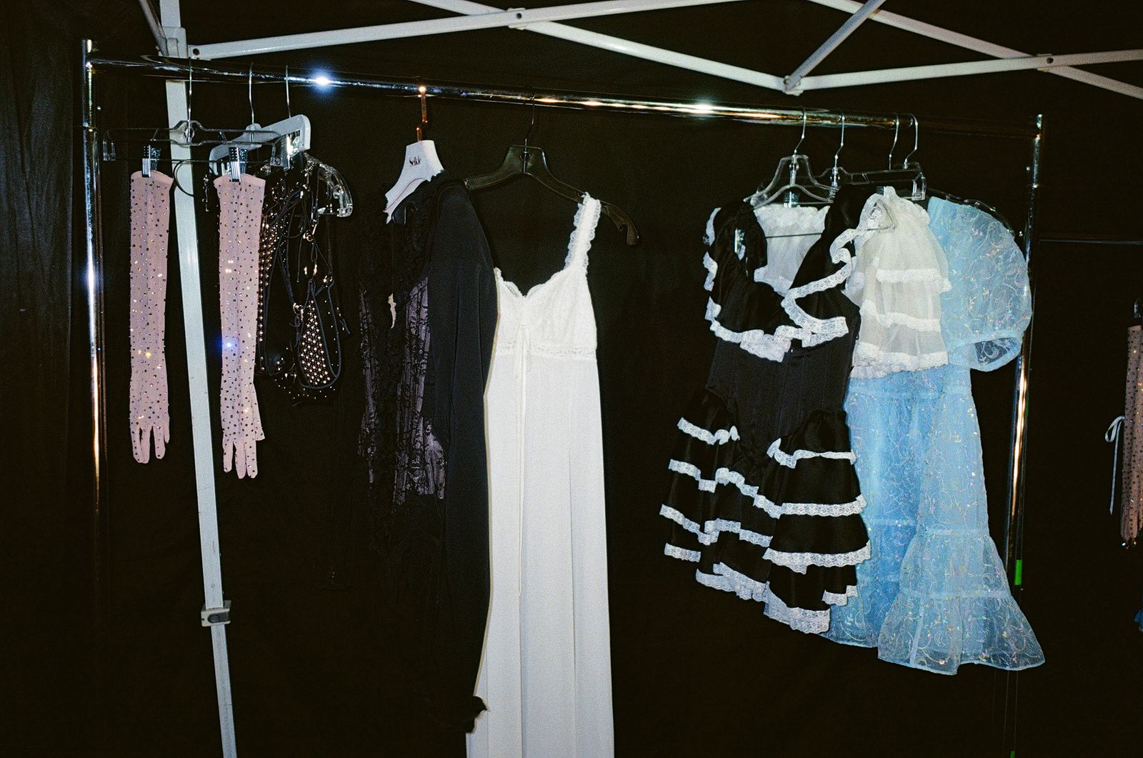 Images may contain locker room interior furniture boutique clothing clothing adult and wedding