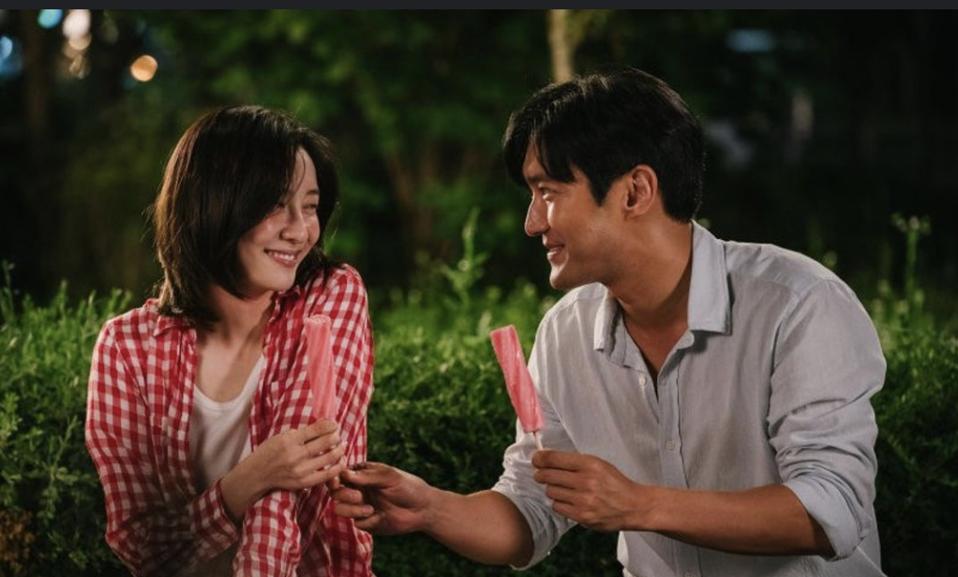 A man and a woman sample ice pops up.
