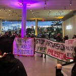 A group of protesters in the museum lobby.