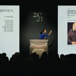 An auctioneer at the podium next to the painting image, showing a woman bent with one hand.