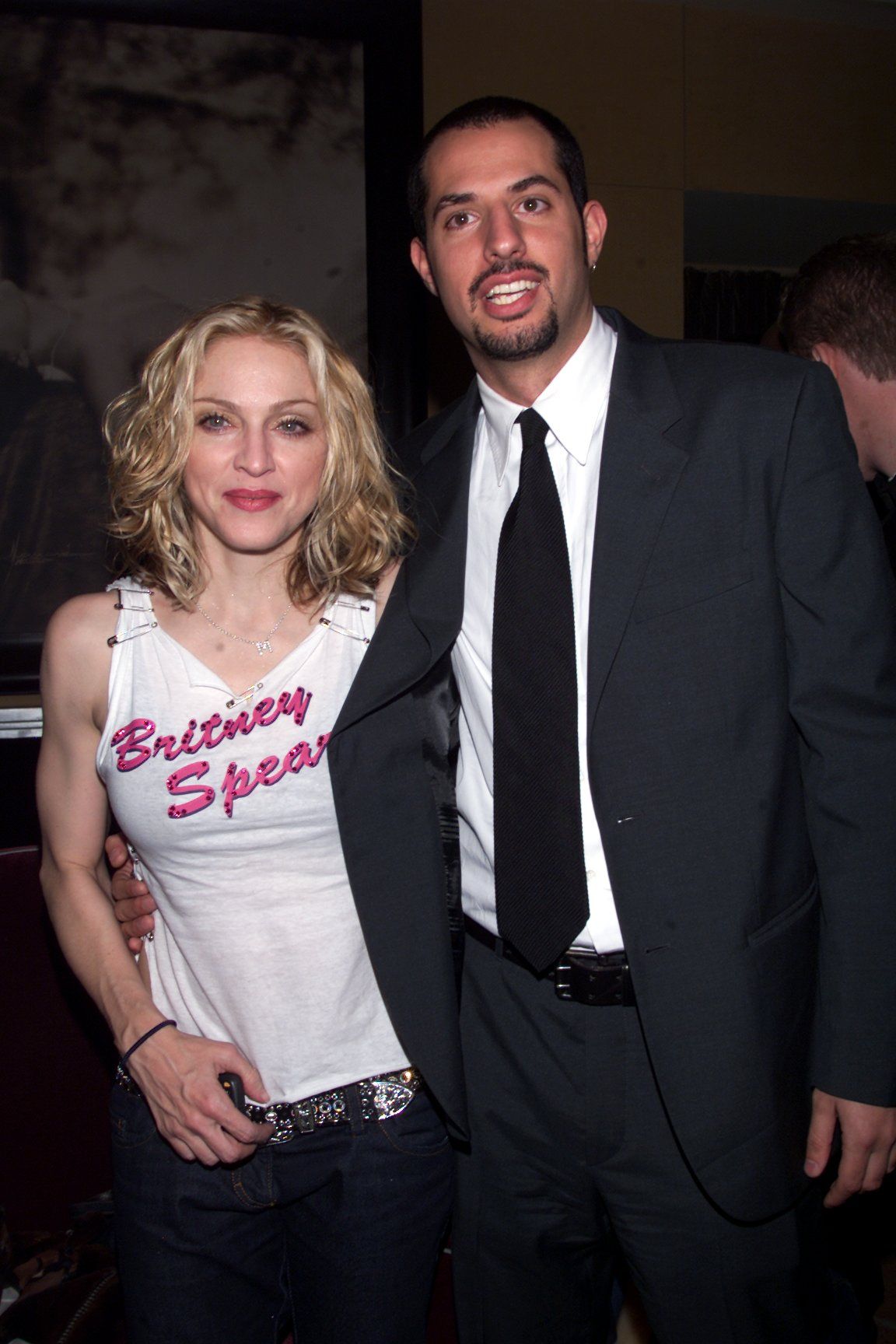 Images may contain Guy Oseary Madonna Blazer Clothing Jacket Formal Wearing Suit Pants Accessories Tie and Face