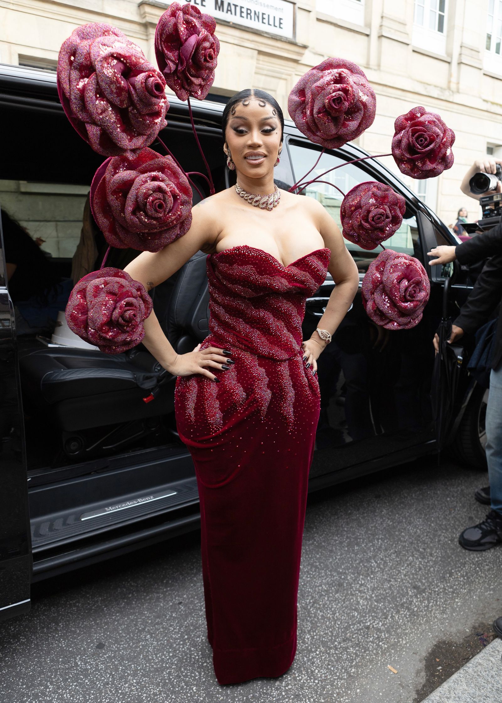 Images may contain Cardi B clothing gown evening dress formally wearing adult accessories jewelry and necklace