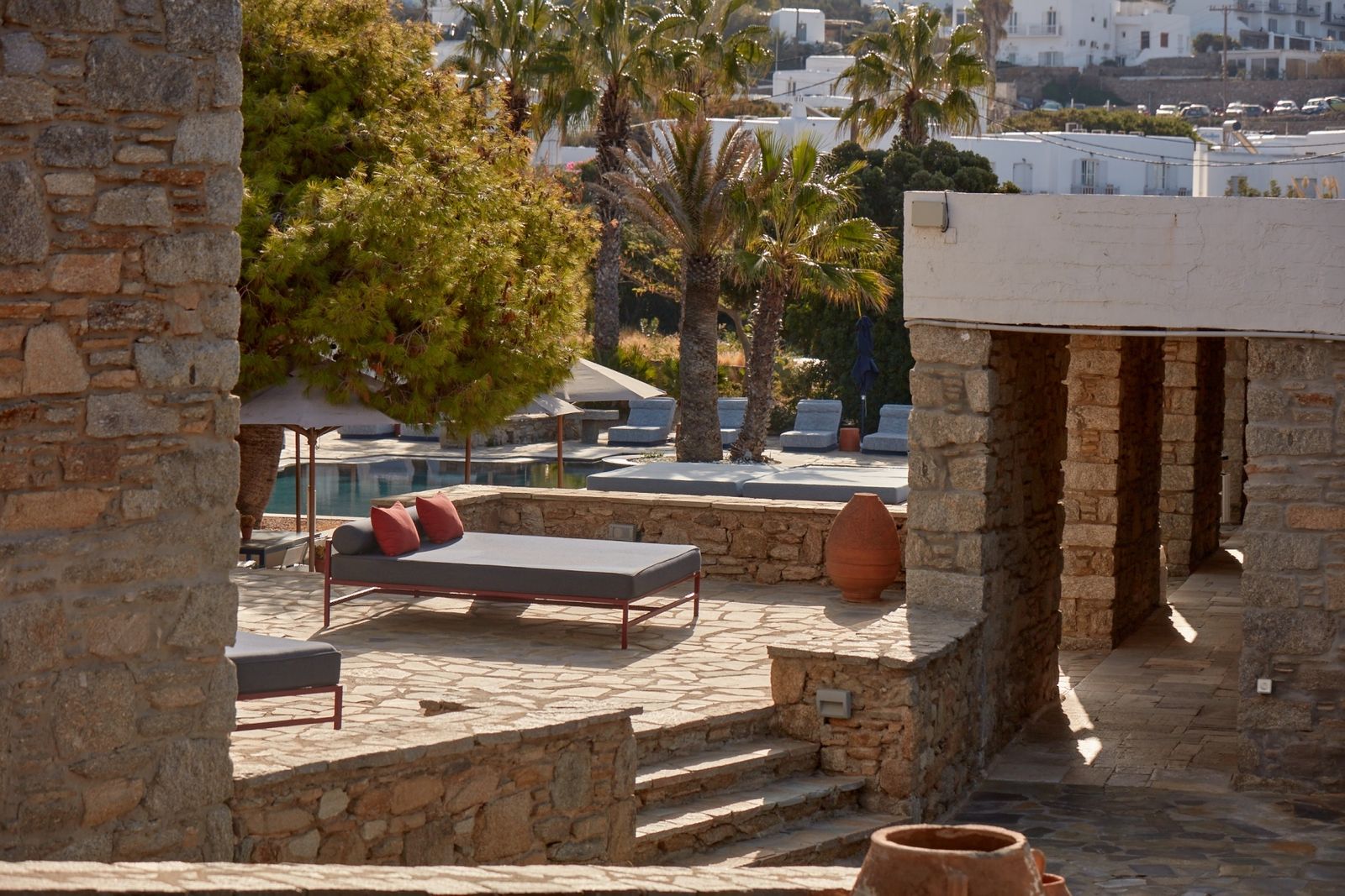 Images may contain terrace city path chair furniture building house house terrace factory and trees