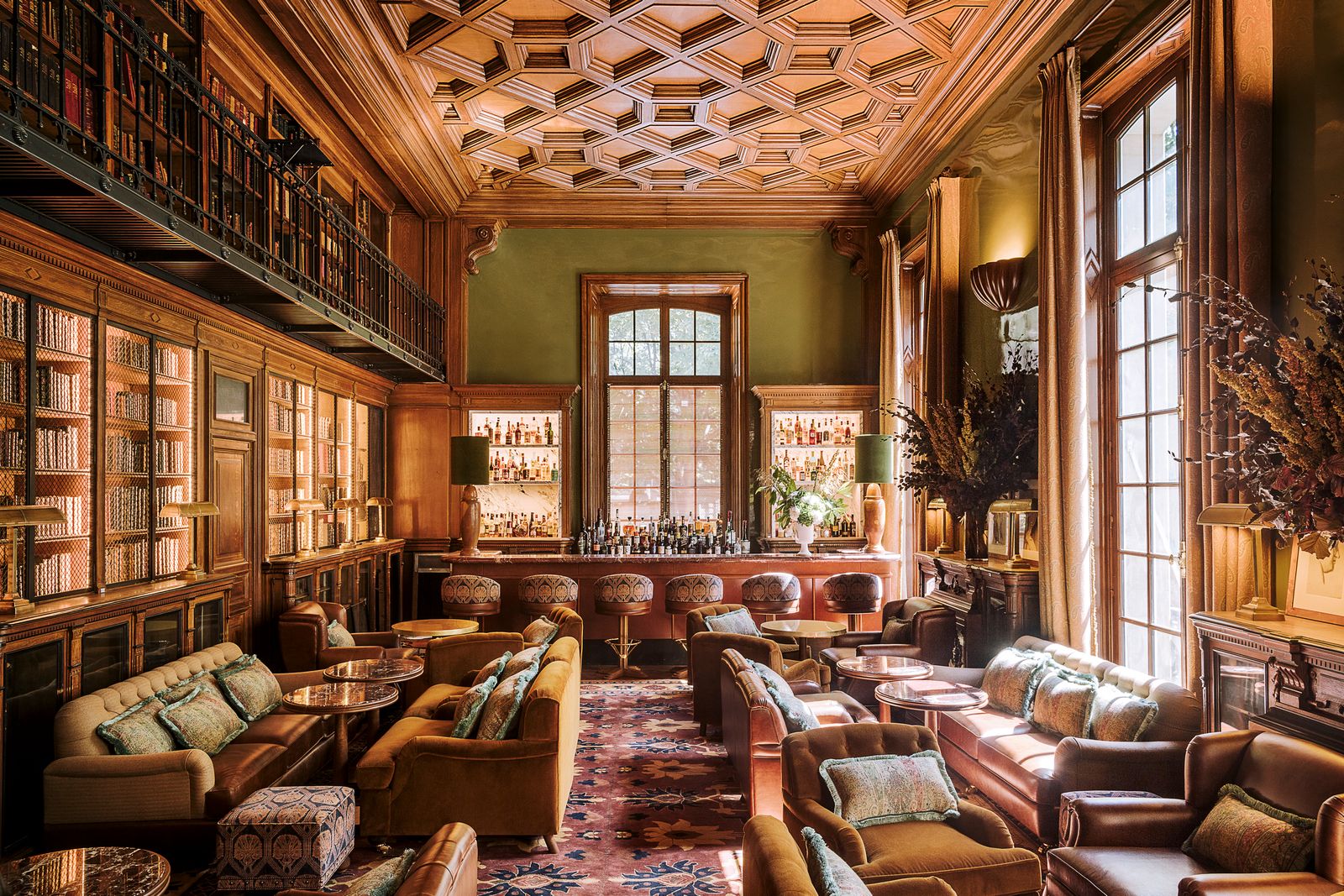 Images may contain indoor living room furniture lobby and sofa