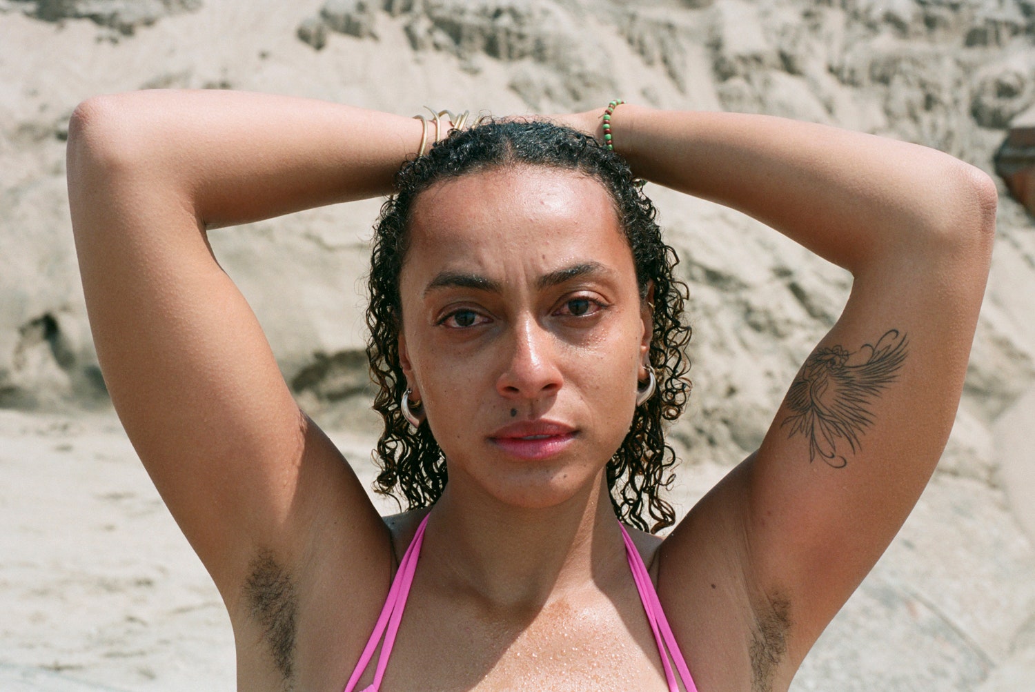 Images may contain human skin face photography portrait tattoo clothing swimsuit body parts and shoulders