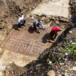 Archaeologists clean mosaics outside of France's Ales.